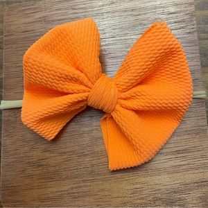 Orange bow on stretchy elastic headband